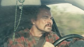 Leonardo DiCaprio driving on a sunny day in One Battle After Another