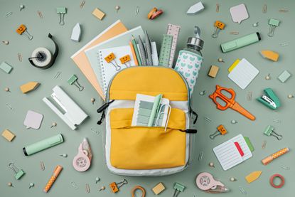 Yellow backpack filled with school supplies for back to school sales tax holiday