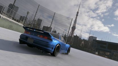 Forza Horizon 6 photo challenge blue nissan car drifting across snow-covered edogawa baseball stadium pitch with tokyo tower in the background