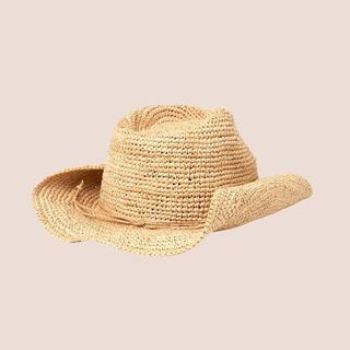 flat lay image of raffia cowboy hat