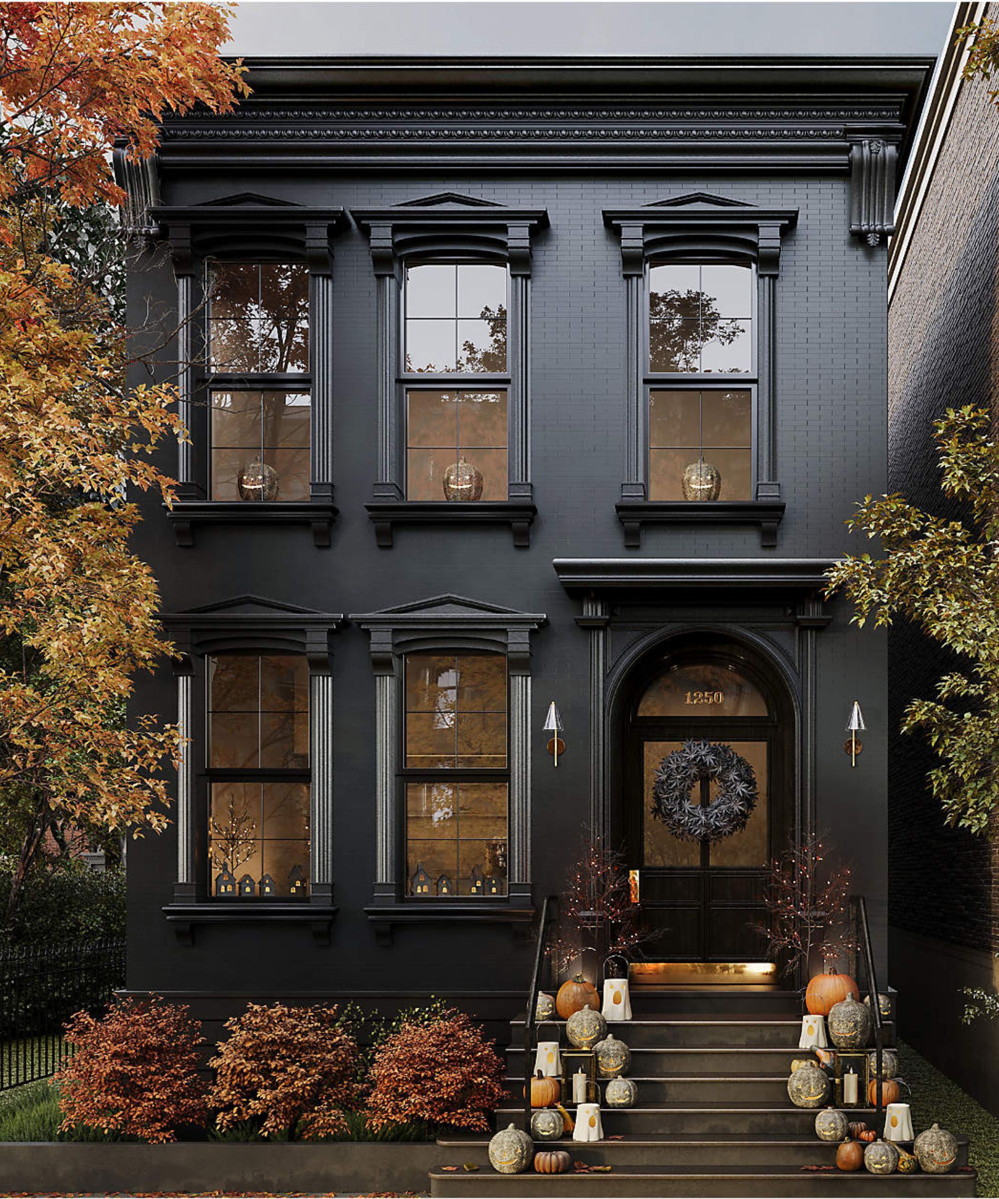 black townhouse with steps up to the porch decorated with pumpkins and lanterns with a black wreath on the door