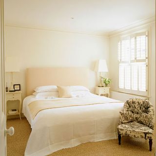 bedroom with white lamp and bedlinen