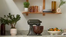 KitchenAid Evergreen Design Series Artisan Tilt-Head 4.7L Stand Mixer with unique Walnut Wooden Bowl in the kitchen