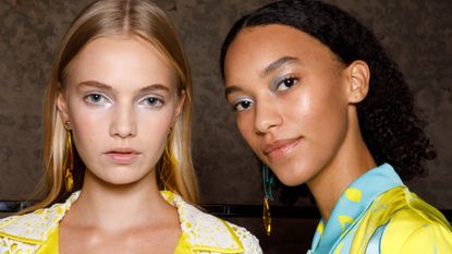 Models wearing eyeshadow pose in the backstage of the Hui fashion show during the Milan Fashion Week - Spring / Summer 2022 on September 26, 2021 in Milan, Italy. 