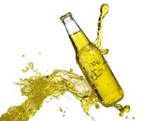 A bottle of a yellow drink.