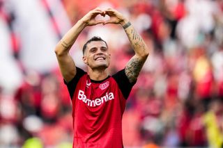 Granit Xhaka of Bayer 04 Leverkusen celebrates his team's win after the Bundesliga match between Bayer 04 Leverkusen and VfL Wolfsburg at BayArena on September 22, 2024 in Leverkusen, Germany.