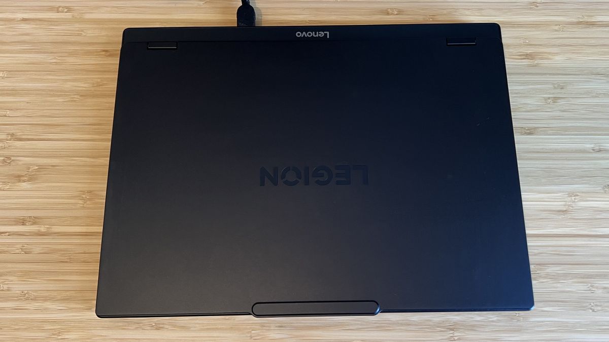 Closed lid on Lenovo Legion 5 Gen 10 gaming laptop sitting on a wooden desk