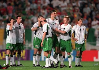 Niall Quinn commiserates with Matt Holland after his penalty miss against Spain