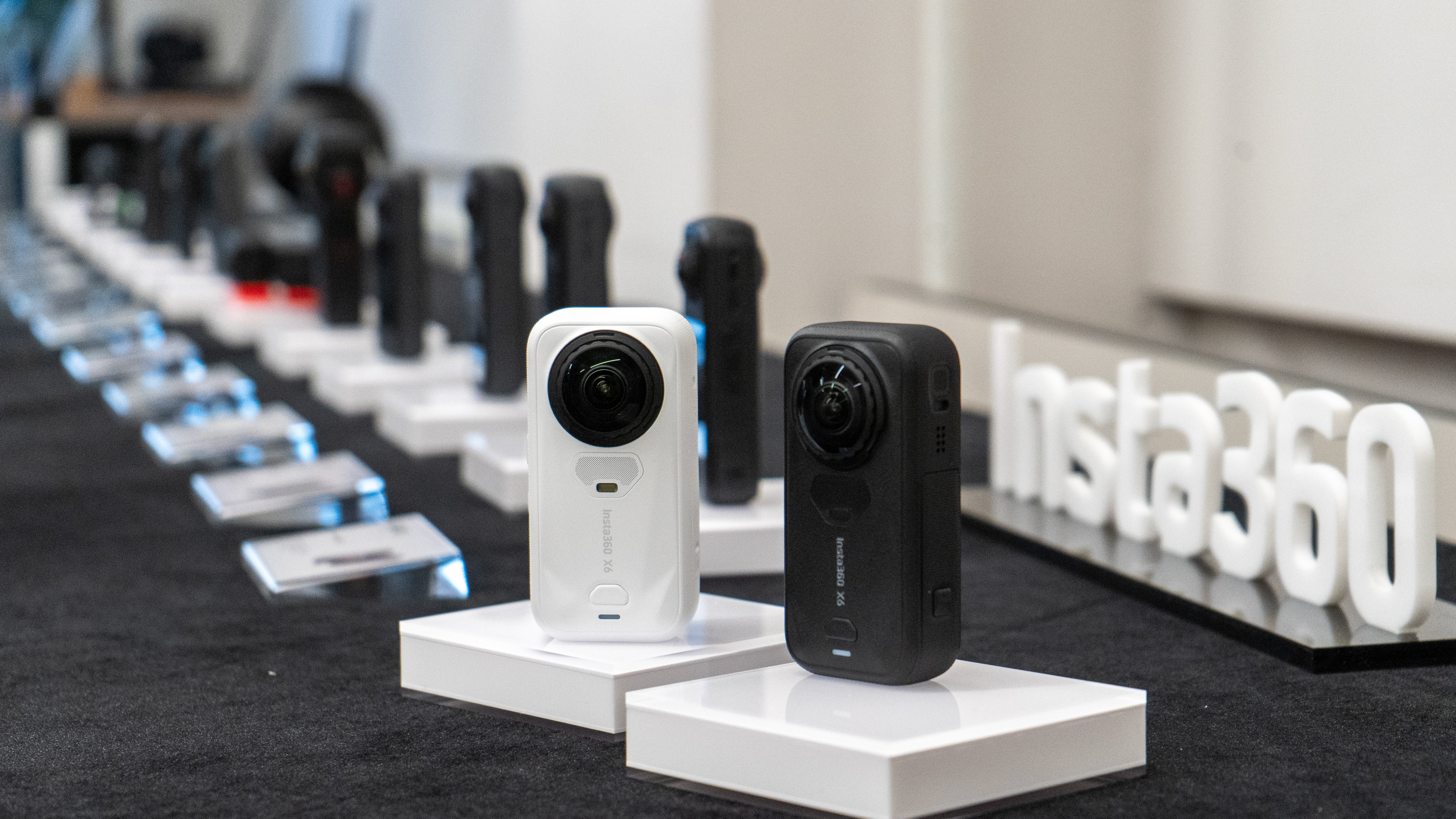 Insta360 X6 in black and white plus old range behind