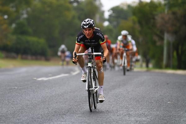 A Merida rider gets into an aerodynamic position to begin a very quick descent.