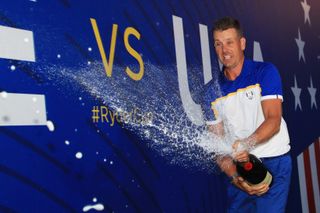 Henrik Stenson celebrates with champagne after Ryder Cup victory