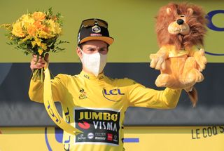 Team Jumbo rider Slovenias Primoz Roglic celebrates his overall leader yellow jersey on the podium at the end of the 15th stage of the 107th edition of the Tour de France cycling race 175 km between Lyon and Grand Colombier on September 13 2020 Photo by Christophe Petit Tesson POOL AFP Photo by CHRISTOPHE PETIT TESSONPOOLAFP via Getty Images