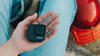 Which is the best GoPro: Pictured here, a person holding the HERO 11 Black mini in her hand