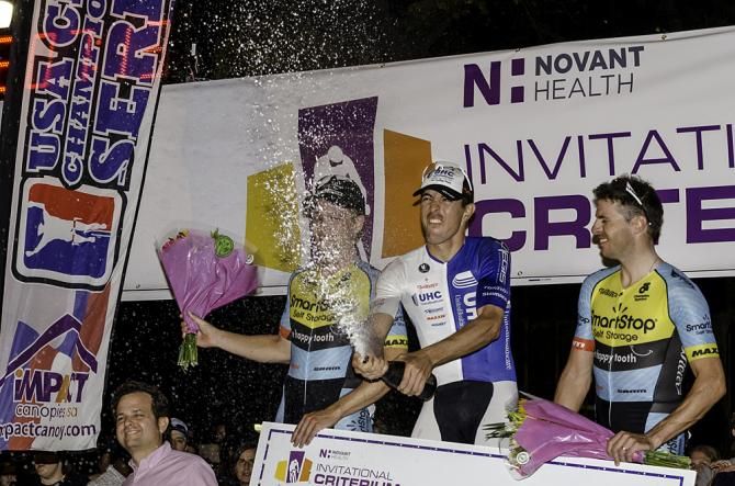 Carlos Alzate pops a shaken bottle alongside Shane Kline and Jure Kocjan.