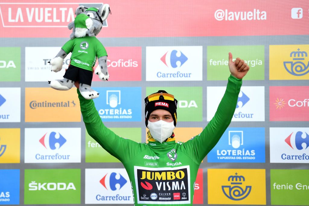 ALTODELANGLIRU SPAIN NOVEMBER 01 Podium Primoz Roglic of Slovenia and Team Jumbo Visma Green Points Jersey Celebration Mascot Mask Covid safety measures during the 75th Tour of Spain 2020 Stage 12 a 1094km stage from Pola de Laviana to Alto de lAngliru 1560m lavuelta LaVuelta20 La Vuelta on November 01 2020 in Alto de lAngliru Spain Photo by Justin SetterfieldGetty Images