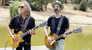 Kirk Hammett (left) and Cesar Gueikian play their prized 'Burst Les Pauls