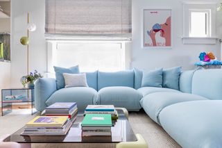A long sofa in pastel blue