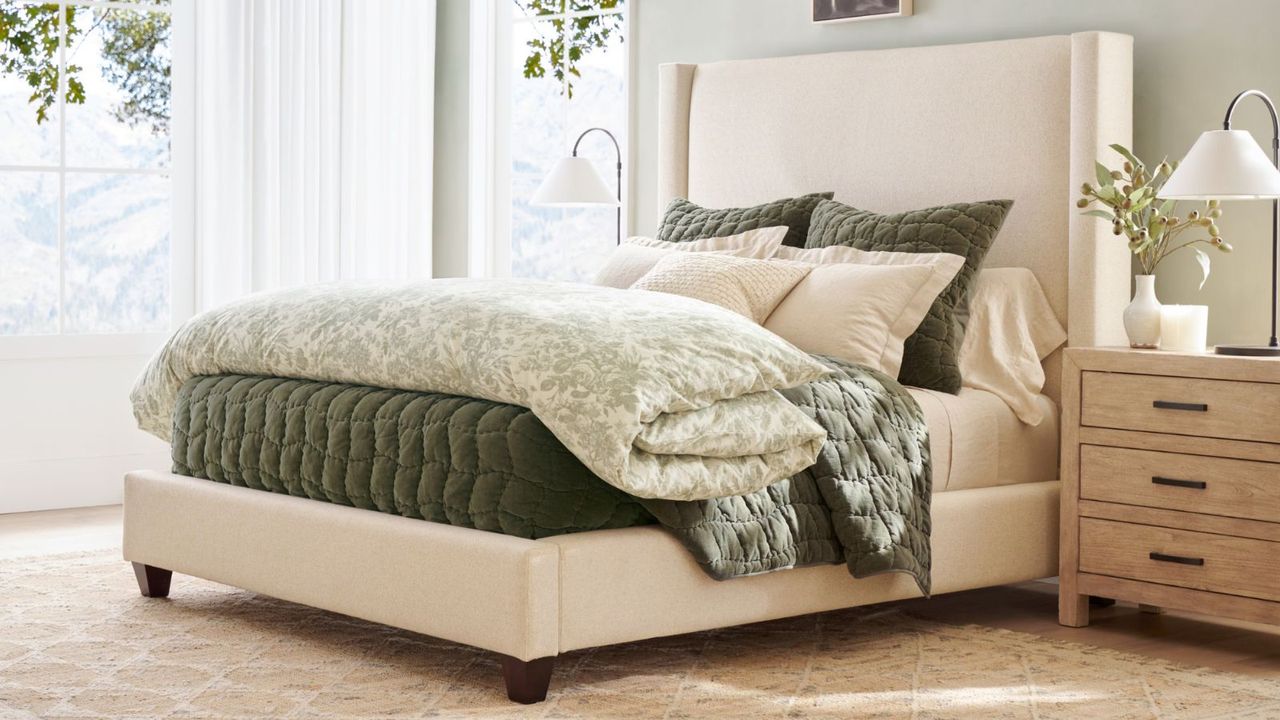 Pottery Barn bedroom furniture in a bedroom against a white wall.