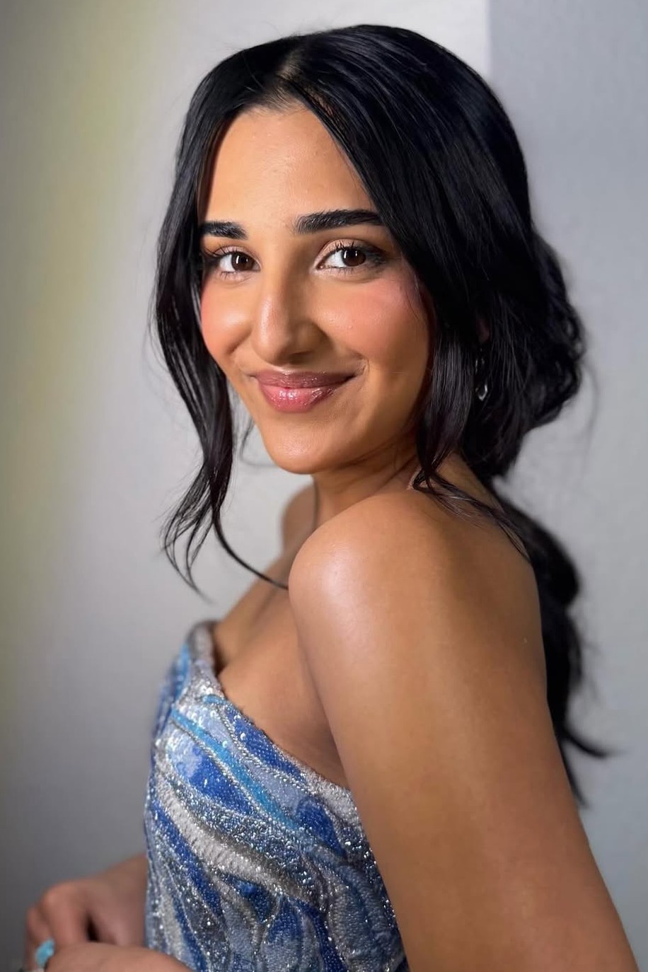 A model showing off a loose, romantic wedding hairstyle.