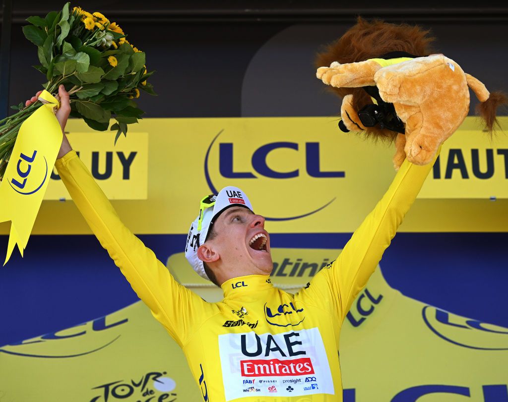 Tour de France leader Tadej Pogačar on the podium after stage 17