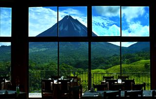 View outside a restaurant window overlooking a volcano in Costa Rica