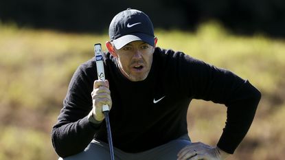 Rory McIlroy looking over a putt at Riviera ahead of the Genesis Invitational