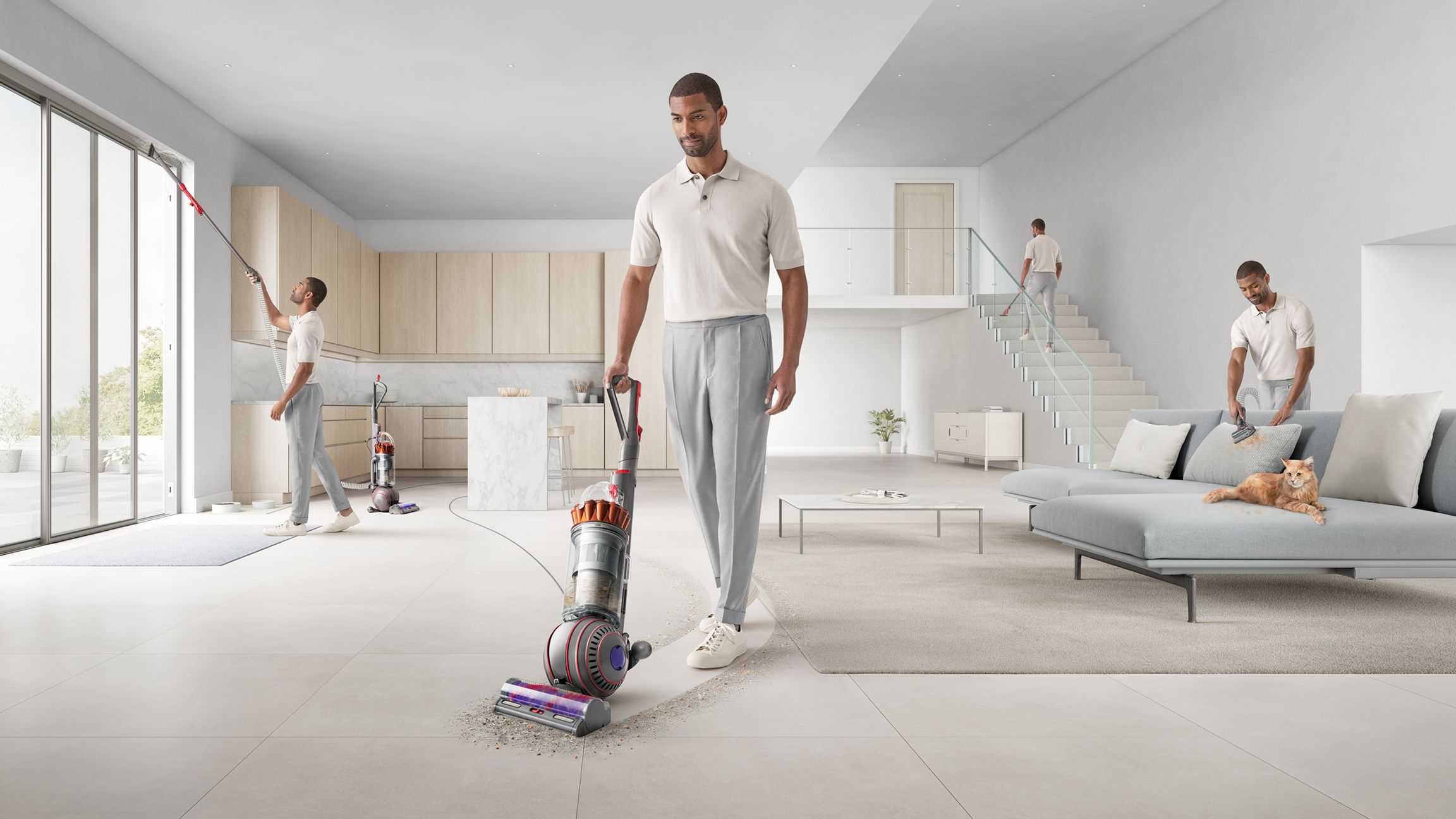 Person using the Dyson Ball Animal 3 upright vacuum cleaner in minimal open-plan space, in different positions around the room such as vacuuming the sofa, curtains, stairs, and floor.