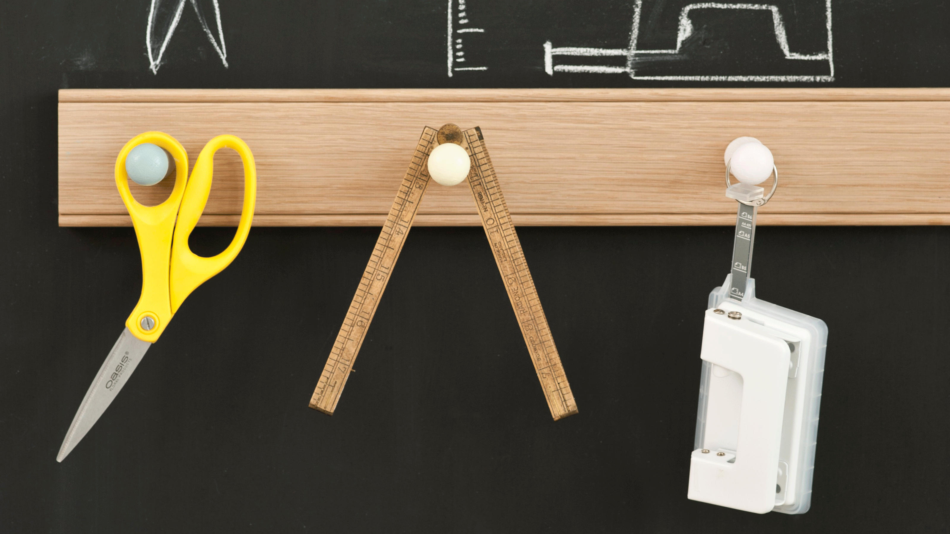 Blackboard with wooden railing and tools