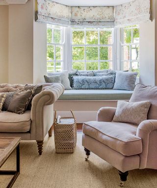 white living room with sofa set and carpet