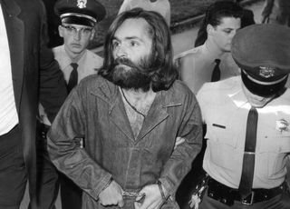 Charles Manson is escorted to court for a preliminary hearing on Dec. 3, 1969, in Los Angeles, California.