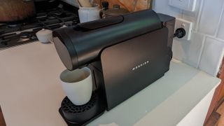 The black model of the Morning Machine on a kitchen counter