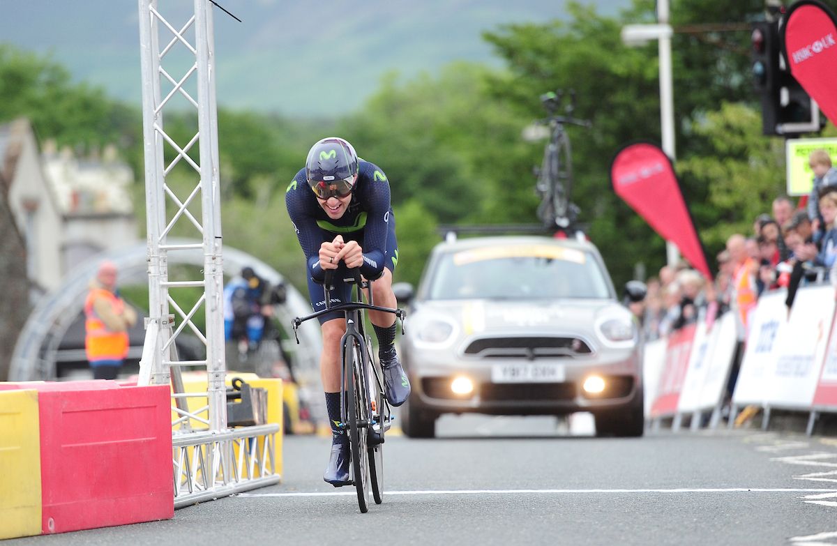 Alex Dowsett crosses the finish line moments before his bike hit the gantry