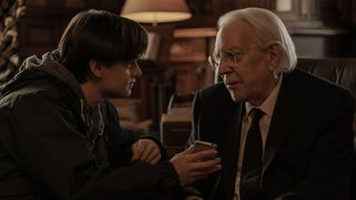 Jaeden Martell as Craig and Donald Sutherland as Mr. Harrigan in Netflix's Mr. Harrigan's Phone