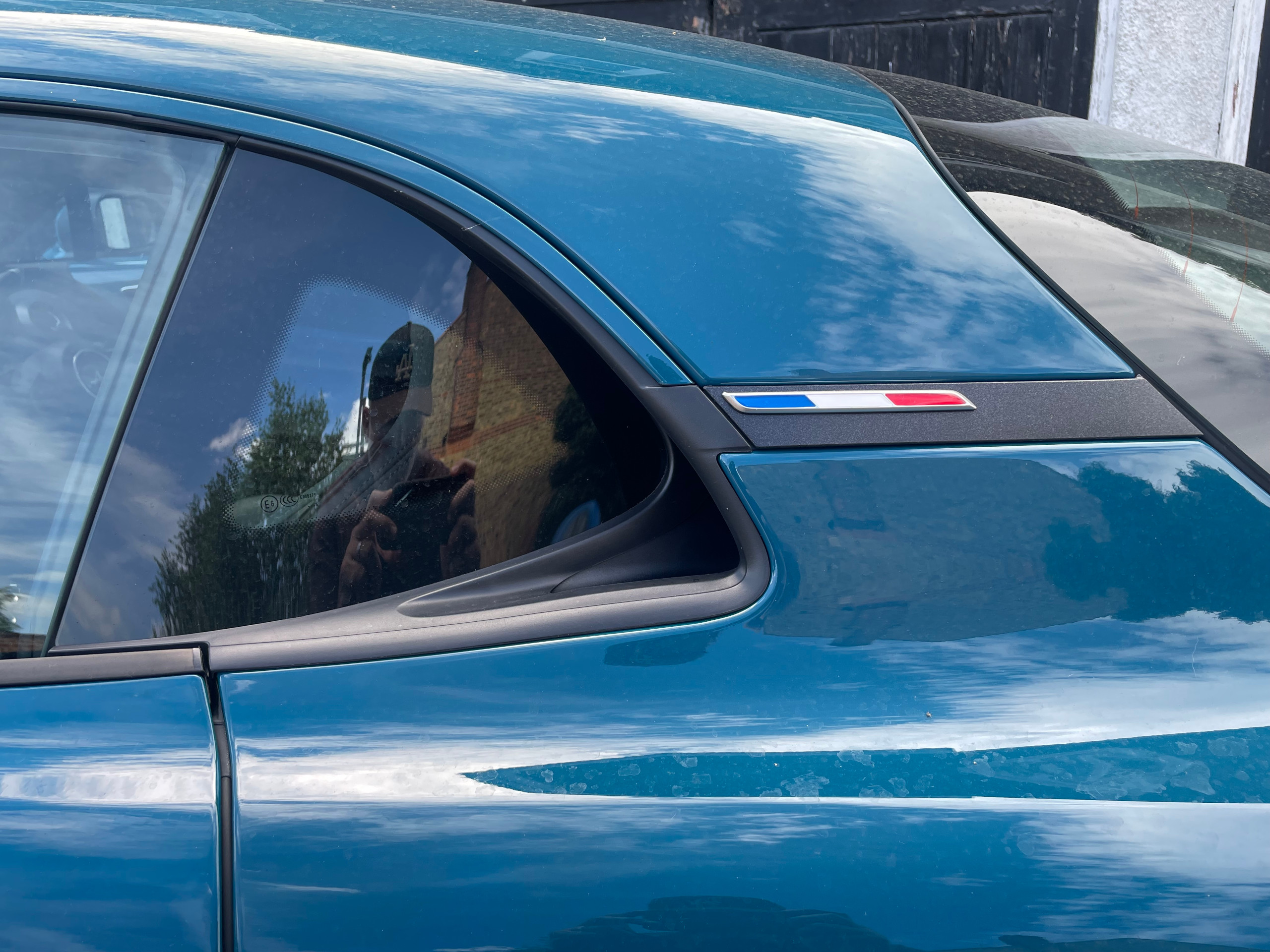 The French flag after the rear vent is a neat touch