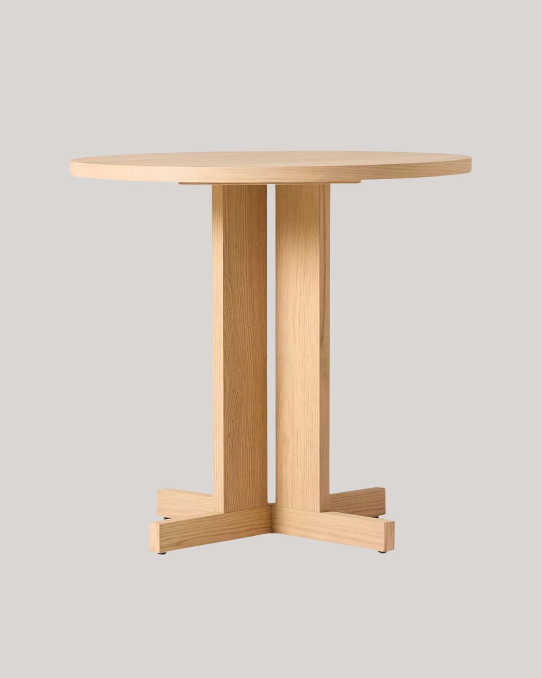 West Elm Rowe Bistro Table, Natural against pale brown background.