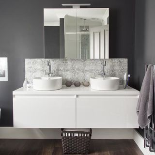 grey bathroom with washbasin and towel rack