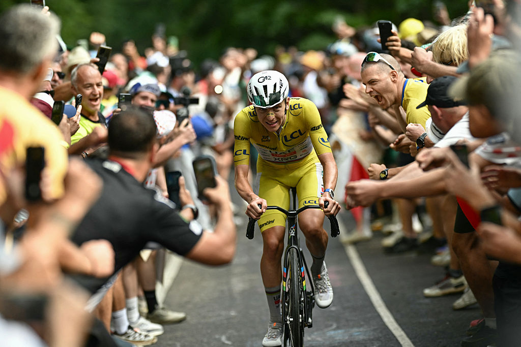 UAE Team Emirates - XRG's Slovenian rider Tadej Pogacar wearing the overall leader's yellow jersey attacks to take the lead in a lone breakaway in the final kilometers of the 14th stage of the 113th edition of the Tour de France cycling race, 155,3 km between Mulhouse and Le Markstein in the Vosges mountains, on July 18, 2026. (Photo by Loic VENANCE / AFP via Getty Images)