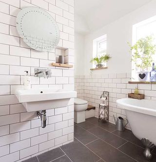 metro tiled industrial style bathroom in a Victorian terraced house