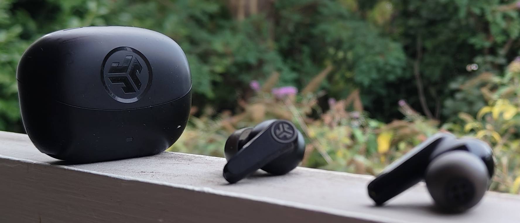 The JLab Go Pods ANC on a window sill.