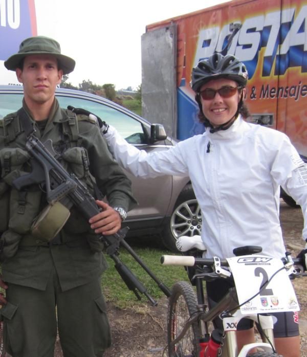 Mary McConneloug poses for a photo with a Colombian soldier.