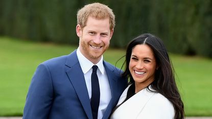 Prince Harry (L) and Meghan Markle during an official photocall to announce the engagement of Prince Harry and actress Meghan Markle at The Sunken Gardens at Kensington Palace on November 27, 2017 in London, England. Prince Harry and Meghan Markle have been a couple officially since November 2016 and are due to marry in Spring 2018. 