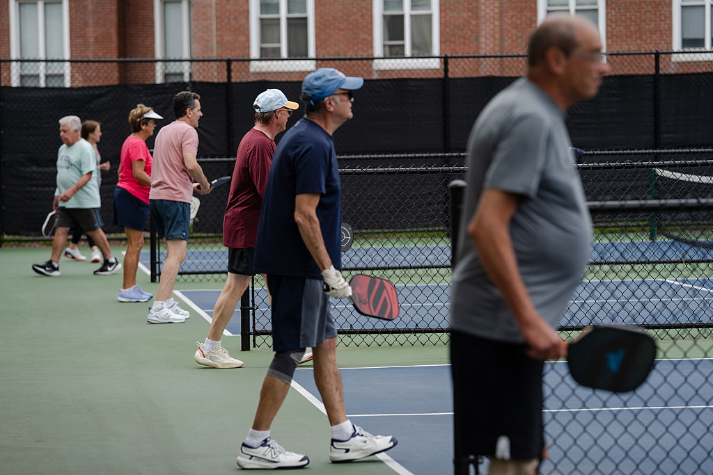 Members of the Braintree Pickleball Players Club fill the courts in Braintree, Mass.