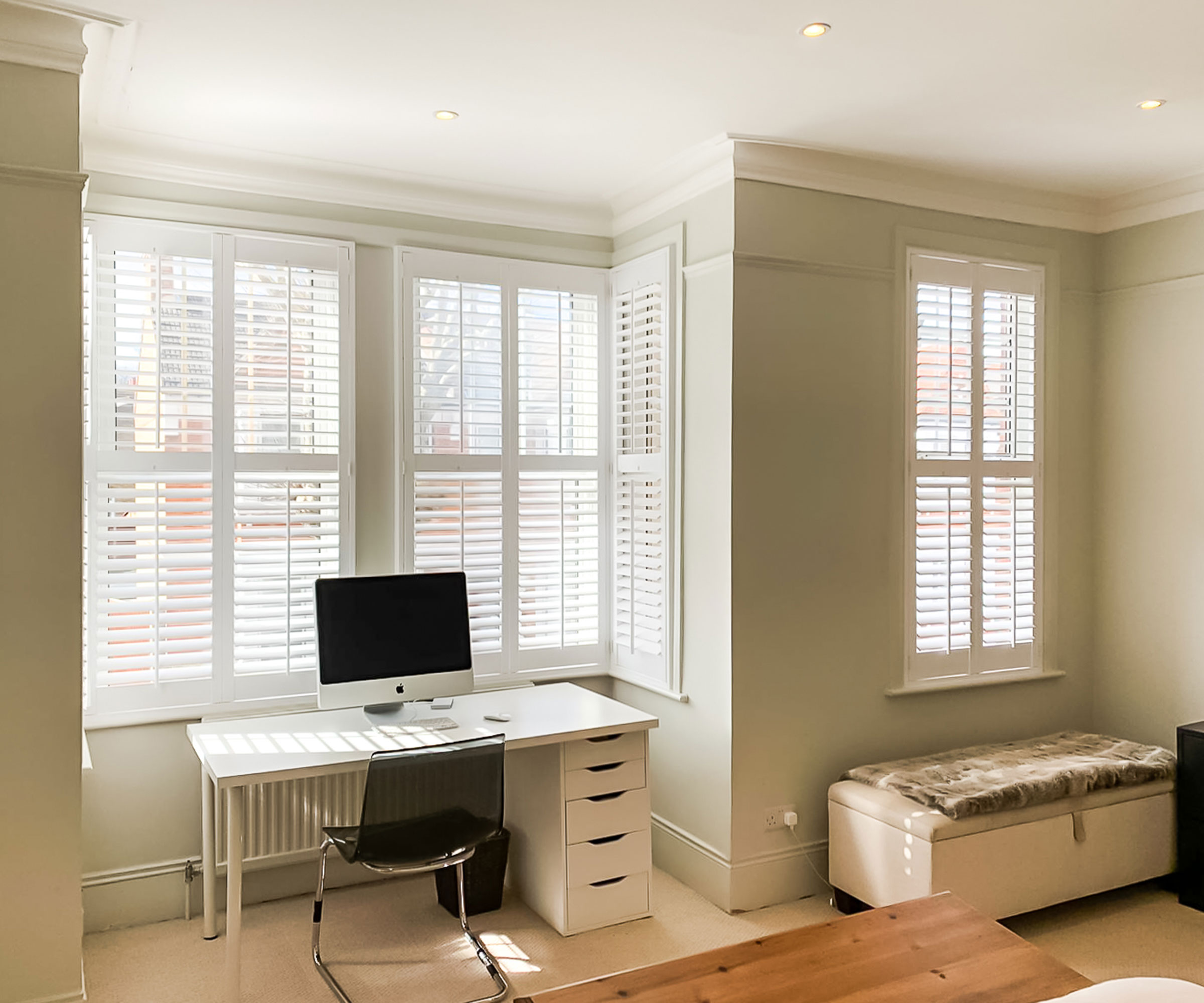 neutral home office with window shutters