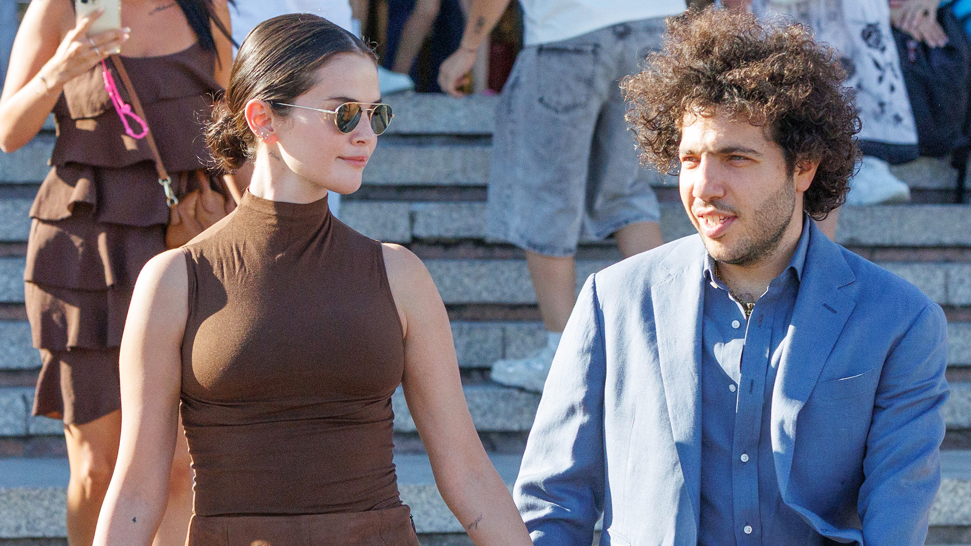 Selena Gomez with Benny Blanco in Venice, where she wore a brown tank and brown Rixo skirt with slouchy witchy boots