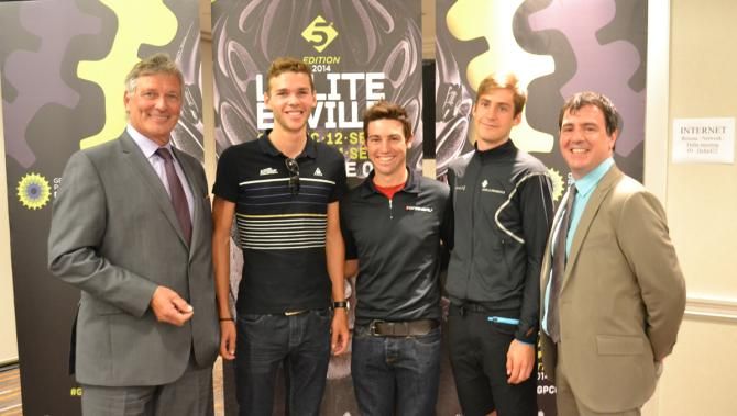 Serge Arsenault (left) poses with the Canadian riders in action at the GP Cycliste de Montreal