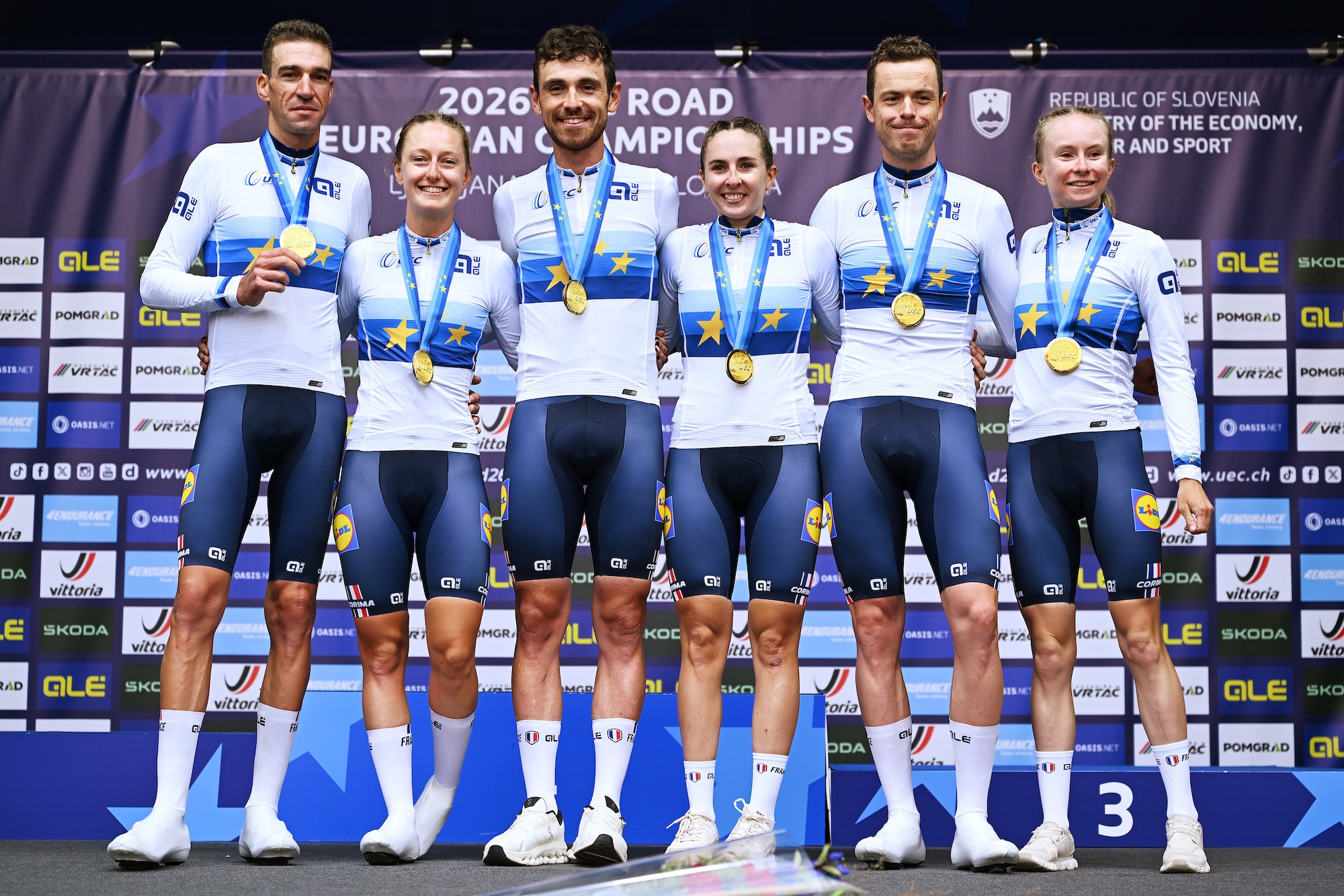 Gold medalists Bruno Armirail, Remi Cavagna, Thibault Guernalec, Juliette Berthet, Cedrine Kerbaol, Maeva Squiban and Team France celebrate winning during the medal ceremony after the 32nd UEC Road Cycling European Championships