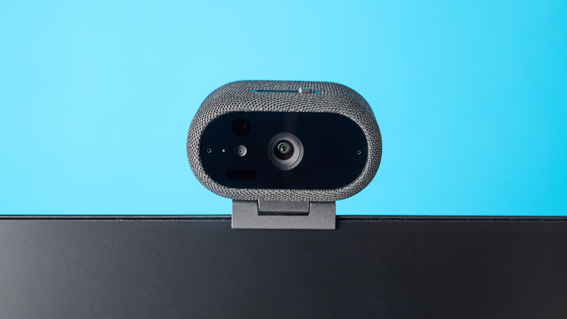 Dell Pro 7 Webcam photographed in front of a blue background