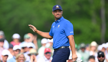 Bryson DeChambeau waves to the crowd