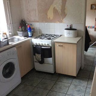 kitchen with washing machine and sink