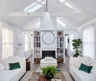 A white open-plan small living room storage idea.